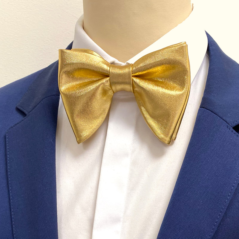 Oversized gold pre-tied bow tie